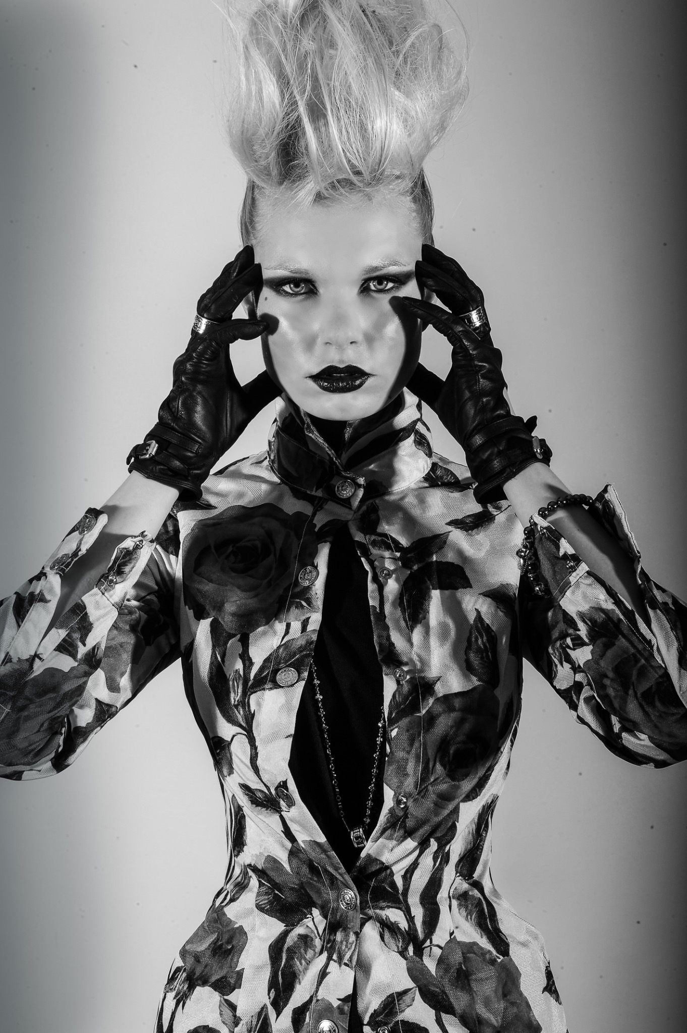 Close black-and-white beauty portrait in patterned couture